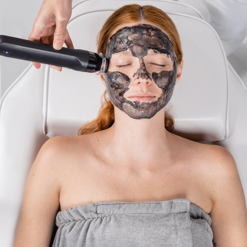 Woman receiving a Geneo Balance facial treatment