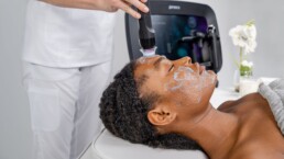 Woman with sensitive skin receiving Geneo facial treatment